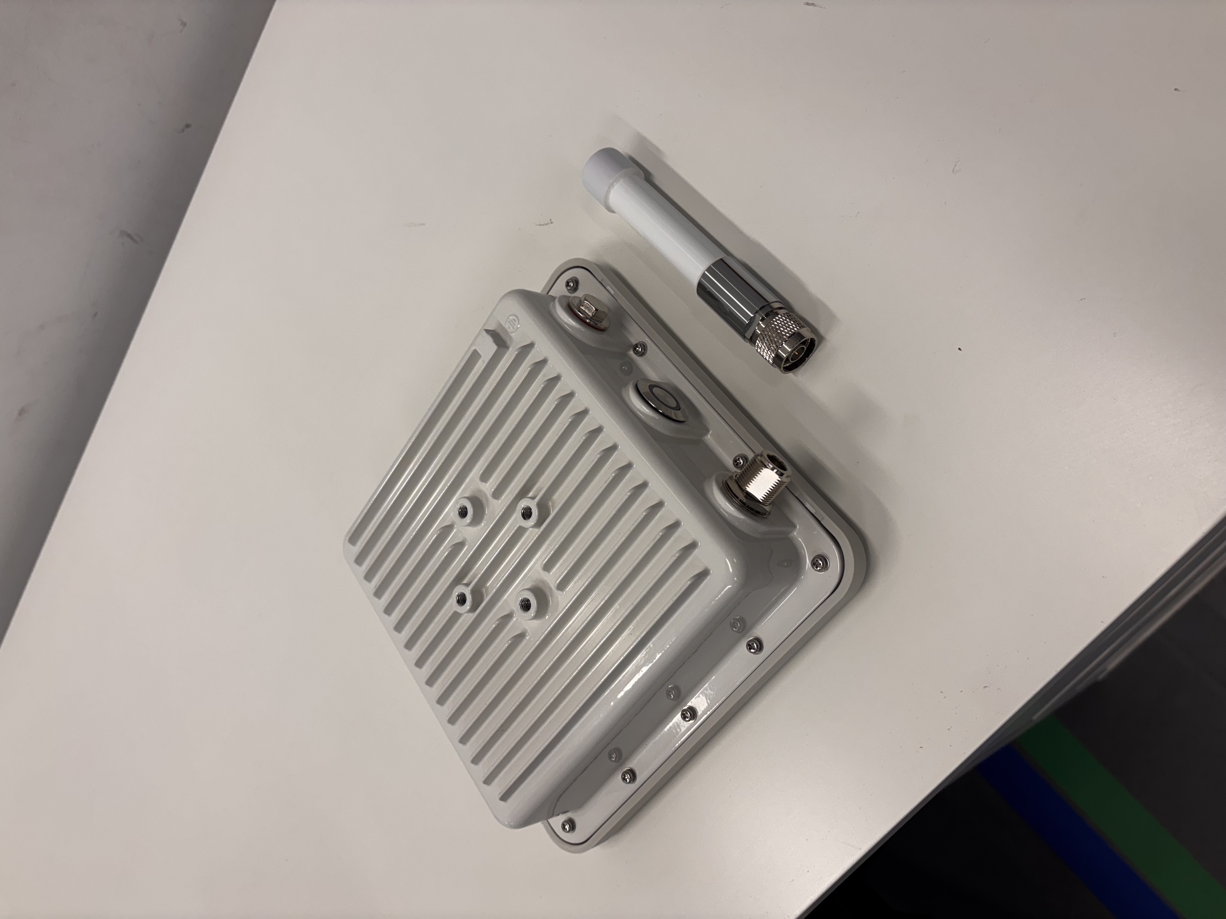Outdoor Gateway with the antenna detached, showing the antenna connector at the bottom of the housing