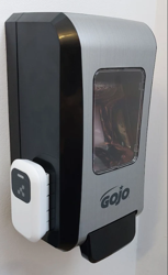 Universal Dispenser Beacon installed on a Gojo FMX-20 dispenser, seen at an angle